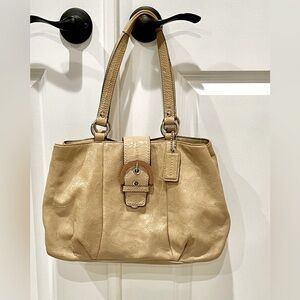 Coach beige patent leather bag. 11x14. Pink interior. Multiple pockets